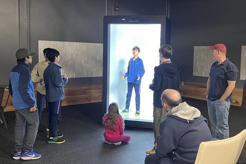 Scouts interacting with the Proto Luma at the Geminai studio